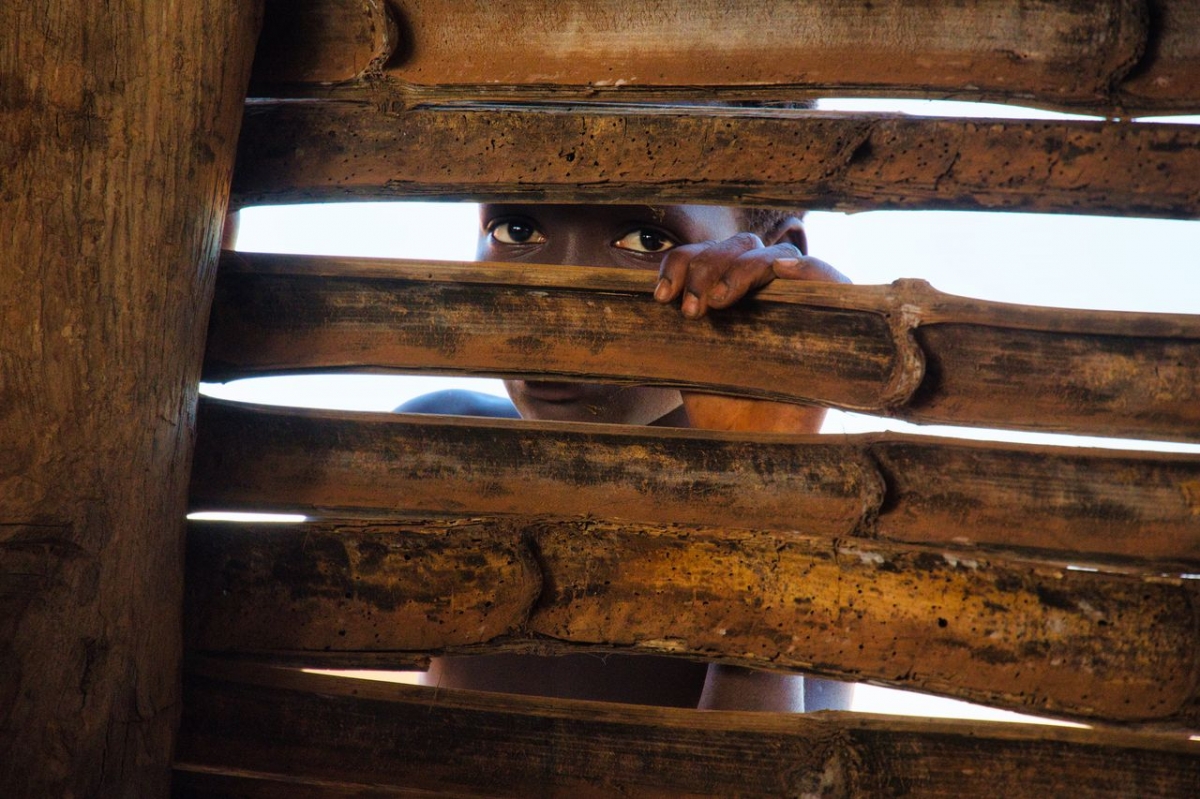 Ivory Coast - child face at a hut in nowhere