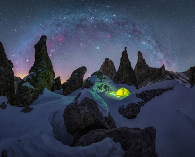 Lost tent in the snow under the winter arch