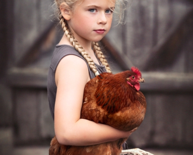 Girl with a hen.