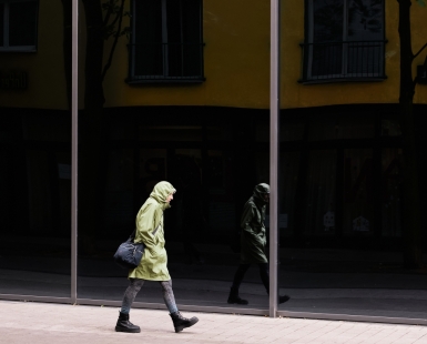 the green coat woman